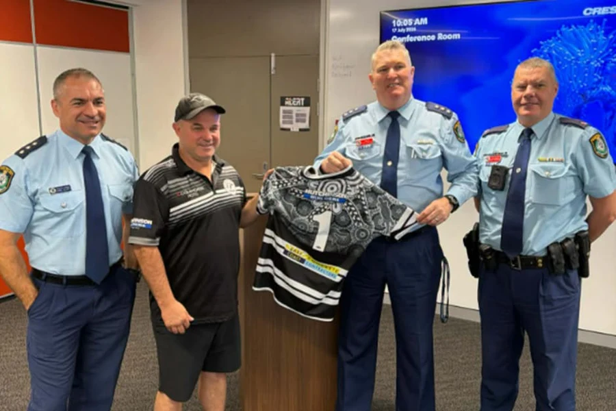 Police officers return stolen Tweed Seagulls jerseys to club coach in Tweed Heads